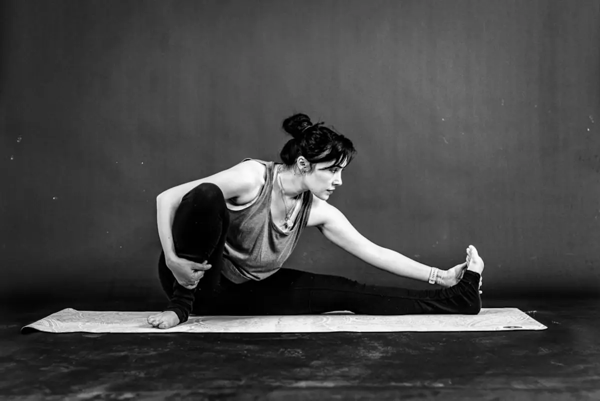 a woman is doing exercises on a yoga mat
