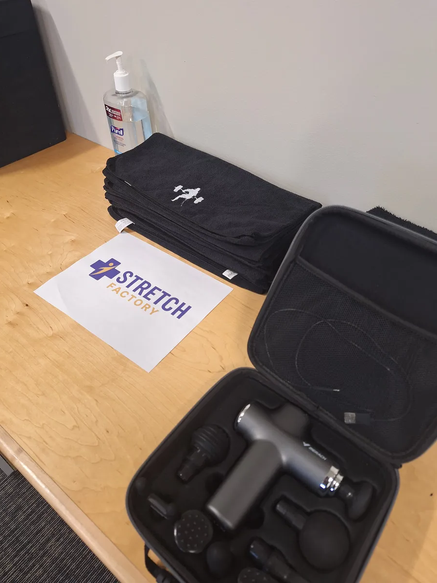 woman doing bridge posts reflecting on water puddle